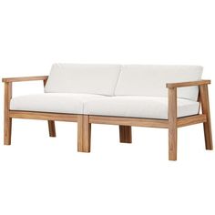 a white couch sitting on top of a wooden frame