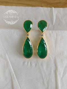 Beautiful Emerald Doublets and best 5A quality Cubic Zirconia earring pair. Base metal is guaranteed silver 925 and is real 18k gold filled to enhance the durability and look. Doublet is nothing more than a natural stone glued to a cheaper stone. The advantage of creating a doublet over selling a synthetic gemstone is that when you view the microscopic inclusions of the stone through a microscope you will see what look like natural inclusions. We use best quality of stones, material and finishing which gives our jewelry that real premium feel. Gold Filling is completely different from Gold Plating as gold filling contains 100% gold which does not go away easily and enhances the life and look of the jewelry. Customer satisfaction is our utmost priority, please rest assured you will get what Classic Plated Earrings For Anniversary, Teardrop Plated Earrings For Gift, Plated Teardrop Earrings As Gift, Plated Teardrop Earrings For Gifts, Luxury Plated Earrings For Anniversary, Formal Fine Jewelry Plated Earrings, Fine Jewelry Plated Earrings For Wedding, Plated Fine Jewelry Earrings For Wedding, Classic Plated Earrings As Gift