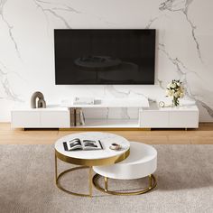 a modern living room with marbled walls and white furniture in front of a flat screen tv