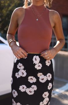 Look effortlessly chic in our Secret Rumor Floral Skirt! This stunning maxi skirt features a chic floral print and is made with lightweight fabric for a comfortable and flattering fit. Dress it down with a tank top or pair it with a cozy sweater for colder weather. Make a statement and feel your best! Fabric 100% polyester Chic Floral Print Maxi Skirt For Brunch, Chic Floral Print Maxi Skirt For Day Out, Spring Day Out Stretch Maxi Skirt, Floral Print Maxi Skirt For Brunch, Chic Stretch Maxi Skirt For Day Out, Stretch Maxi Skirt For Spring Day Out, Spring Stretch Maxi Skirt For Day Out, Spring Maxi Skirt For Date Night, Feminine Fitted Floral Print Maxi Skirt