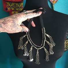 "Beautiful \"shoelace\" necklace with rigid brass stations that have great woven chains & dangles. This is a great looking, affordable piece. It fastens with a vintage button & is about 16\" in length. Please note that all of these have slightly different dangles, please message me if this is an issue. ❤️"