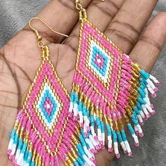 New Pink, Turquoise Blue, Metallic Gold Beaded Fringe Tassel Earrings Colors: Pink, Turquoise Blue, Metallic Gold, White Length: Approximately 4” Sparkly Light Weight Weight: 6g Dangle / Drop Style: Native American, Boho, Bohemian, Ethnic Boutique Style Earrings Tags: Jewelry, Accessories, Eye Candy, Ethnic, Boho, Native American, Seed Bead, Rice Bead, Beaded, Handmade, Colorful, Artisan, Shiny, Sparkle, Sparkly Traditional Pink Jewelry For Summer, Traditional Pink Jewelry With Tiny Beads, Pink Beaded Earrings With Dangling Beads For Festivals, Festival Turquoise Beaded Earrings With Colorful Beads, Pink Small Beads Earrings For Festival, Pink Beaded Earrings For Beach With Tiny Beads, Handmade Pink Beaded Earrings For Beach, Pink Beaded Earrings For Festival, Pink Tiny Beaded Earrings For Festival