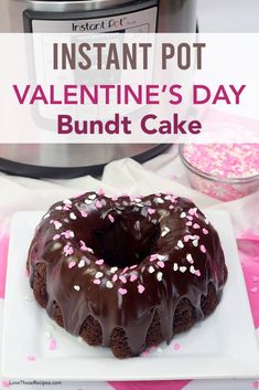 a chocolate bundt cake on a plate with sprinkles and an instant pot in the background