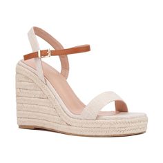 A summer style essential, the Unita espadrille sandal features platform wedge heels that provide both height and comfort. Contrasting ankle straps add a distinctive touch to the design, while polished buckle closures enhance the sandal's sophisticated appeal. Perfect for pairing with sundresses, shorts, or skirts, the Unita sandal effortlessly combines chic style with practicality. Elevate your warm-weather wardrobe with this versatile espadrille, ideal for adding a touch of elegance and ease to Closed Toe Wedge Sandals With Heel Strap For Summer, Beige Block Heel Wedge Sandals For Spring, Trendy Beige Wedge Sandals With Ankle Strap, Trendy Beige Ankle Strap Wedge Sandals, Summer Wedge Sandals With Heel Strap And Round Toe, Summer Wedge Sandals With Heel And Ankle Strap, Chic Wedge Sandals With Ankle Strap For Summer Outings, Beige Adjustable Ankle Strap Wedge Sandals, Chic Ankle Strap Wedge Sandals For Summer Outings