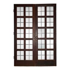 an open wooden door with glass panels