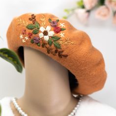 The hand embroidered floral wool beret is a stunning and unique headpiece made with high-quality wool material. Featuring delicate and intricate floral embroidery, each beret is carefully crafted by hand, making it a one-of-a-kind accessory.  Material: 100% wool Size: inner diameter measures 6 inches, outer diameter measures 11 inches, inner circumference measures 20 inches. Beret can be stretch out slightly by gently pulling around the brim, making it fit head sizes from 20-22.8 inches. Color: I can embroider the pattern on any color beret that you request. If no message is included with the order, the default color would be the same as the photo. Washing instruction: because the wool beret is a delicate material, putting in washing machine will damage both the hat and the embroider. Hand Embroidered Beret, Womens Hat, Wool Beret, Hand Making, Wool Berets, Berets, Cool Hats, Make It Work, Floral Embroidery