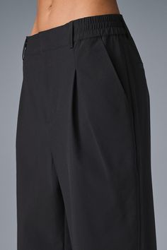 A shorter version of our best-selling Pursuit Trousers, this modern fit is the ultimate closet staple. They have a high-rise waistband (flat in front and stretchy in back), tailored details (belt loops and pleats), and a relaxed, wide-leg fit. Plus, they’re made from a lightweight, stretch-infused fabric that looks sleek and feels totally comfortable. You'll go straight from work to your weekend plans with just a change of shoes. Alo Yoga 4-way Stretch Elastane Bottoms, Versatile Solid Color Alo Yoga Bottoms, Versatile Alo Yoga Bottoms, Alo Yoga Elastane Bottoms With 4-way Stretch, Alo Yoga Elastane 4-way Stretch Bottoms, Alo Yoga 4-way Stretch Bottoms, Black Short Length Bottoms For Office, Fitted Black Alo Yoga Pants, Alo Yoga Wide Leg Pants With Elastic Waistband