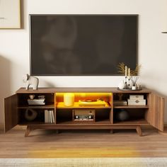 an entertainment center with a blackboard in the corner and yellow light coming from it