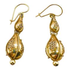 This is part of Chairish’s Fine Jewelry assortment.  A fine Victorian period pair of 14K gold earrings with French wires and hooks for pierced ears. The earrings have Etruscan beadwork applied to both the top and the bottom drop. They are not marked, but test 14K. Condition is excellent.  Dimensions: Length to top of wire: 1 1/2", Diameter: 1/2", Weight: 3.9 grams Traditional 14k Gold Drop Earrings, Victorian Hallmarked 14k Gold Earrings, Antique Yellow Gold Ceremonial Earrings, Antique Yellow Gold Drop Earrings, Victorian 14k Gold Filigree Earrings, 14k Gold Victorian Filigree Earrings, Victorian Yellow Gold Earrings With Intricate Design, Victorian Yellow Gold Drop Earrings, Victorian 14k Gold Drop Earrings