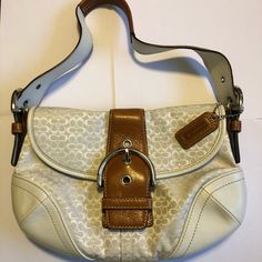 I Coveted This Bag For So Long, And When I Finally Bought It I Never Used It Out Of Fear Of It Getting Dirty! So Now This Bag Is Considered Vintage And Is In Mint Condition! There Are No Stains And No Signs Of Wear On This Bag! It Has The Mini Signature C Design In White On White, With White Leather On The Bottom And Dark Brown Leather Accents And Handle. This Bag Is Beyond Gorgeous! It Also Has An Inside Flap Pocket, Shown In Picture 4 As Well As The Regular Inside Complete With A Zipper Pouch. White Coach Evening Bag, White Bags With Silver-tone Hardware For Formal Occasions, Formal White Bags With Silver-tone Hardware, White Tote Shoulder Bag With Silver-tone Hardware, Coach White Leather Shoulder Bag, White Leather Coach Shoulder Bag, White Coach Satchel Shoulder Bag, Designer White Coach Shoulder Bag, Classic White Shoulder Bag With Leather Handles