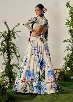 Celebrate summer with this pastel floral lehenga, featuring crystal highlights and beadwork at the waistband. The skirt's blooming print adds vibrant character, while the blouse with a sweetheart neckline and full sleeves completes the look. Includes a matching dupatta. Printed Lehenga, Floral Lehenga, Pastel Floral, Full Sleeves, Floral Printed, Full Sleeve, Sweetheart Neckline, Lehenga, Bead Work