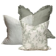 two pillows with ruffled edges and one in grey, the other in light green