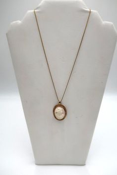 "For Sale: (1) t380 10k/14k 18\" Box Cameo Pendant Necklace PLEASE READ ENTIRE DESCRIPTION BEFORE PURCHASING Pre-owned item. Good condition. Please see pictures for details. Sold as is, as seen on pictures. No returns on vintage/antique items. Would be a nice, birthday, Christmas, Mother's Day or Valentine's Day gift for her.   This antique carved conch shell cameo portrait of a Bacchanalian maiden pendant is set in a 10K  gold bezel within a border of 10K yellow gold leaves and has a sturdy bail.  Those females who attended the festivals of Bacchus, the Greek God of wine and agriculture are often depicted with grapes in their hair.  The pendant is hung on 14k Gold Box Chain.The chain is stamped. Specifications : Metal : 10k & 14k Gold Pendant : 1 1/2\" x 1\" Chain : 14k Gold,Box Chain,18\ Cameo Pendant Necklace, Greek God, Gold Box, Gold Leaves, Cameo Pendant, Valentines Day Gifts For Her, Conch Shell, Fine Jewellery Necklace, Saint Louis