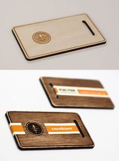 two wooden business cards sitting on top of each other