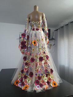 a dress made out of flowers is on display