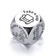 a metal dice with the words take a seat on it