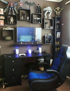 a room with a desk, chair and shelves filled with figurines on the wall