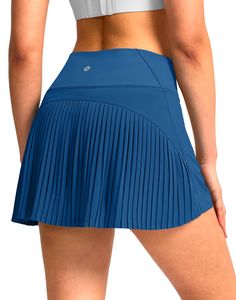 PRICES MAY VARY. Lightweight, Sweat-wicking: Outer layer on this tennis skirt is made of light and breathable fabric, wicks moisture well when sweating, also makes a flowy appearance. Pleated Design & High-rise: Features flattering pleats at back and structured a-line silhouette. Elastic wide waistband provide tummy control which cinches your waist for a slimming and cute look. Soft Built-in Shorts: 5" inseam shorts underneath, long and soft enough to offer a comfortable fit with modest full coverage. Use stretch knit material to stay it in place firmly, do not ride up and not be see-through, prevent to chafe on thighs as you move around. Phone & Ball Pockets: 2 drop-in pockets on the liner are large for phone or any personal items. Also convenient to keep balls for tennis, golf and pickle Golf Skorts, Athletic Skirts, Athletic Skort, Pleated Tennis Skirt, Golf Skort, Athletic Top, Tennis Skirt, Wide Waistband, Skirts With Pockets