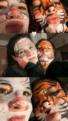 two girls with their faces painted like tigers