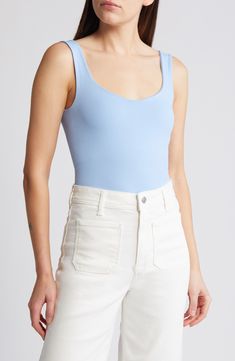 Love to layer in this shapely tank bodysuit designed with a perfectly scooped neckline. Scoop neck Sleeveless 92% nylon, 8% elastane Machine wash, dry flat Made in the USA Blue Scoop Neck Seamless Bodysuit, Blue Seamless Bodysuit With Scoop Neck, Spring Scoop Neck Bodysuit With Built-in Bra, Blue Seamless Scoop Neck Bodysuit, Summer Nylon Tank Top With Scoop Neck, Spring Basic Scoop Neck Bodysuit, Basic Scoop Neck Bodysuit For Spring, Fitted Elastane Scoop Neck Tank Top, Casual Second-skin Bodysuit With Scoop Neck