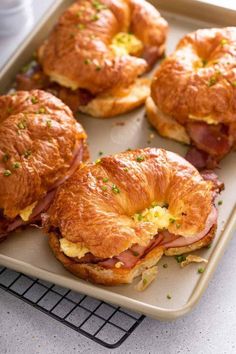 ham and cheese croissants on a baking sheet