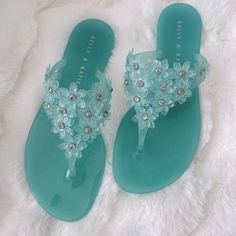 Color Turquoise. Never Worn New In Box. Size 7. Floral With Crystal Blue Jelly Sandals With Round Toe For Party, Blue Jelly Sandals For Summer Party, Blue Jelly Sandals For Spring Party, Blue Jelly Sandals For Spring Vacation, Green Leather Sandals, Summer Sandals Heels, Fancy Sandals, Jelly Flip Flops, Crystal Sandals