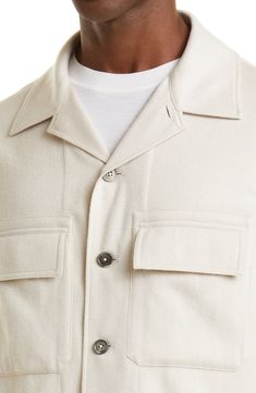 Crafted from the label's sumptuously soft, lightweight Oasi cashmere, this overshirt is fashioned with roomy pockets at the chest and a convertible collar. Front button closure Convertible collar Long sleeves with button cuffs Chest flap-patch pockets Lined 100% cashmere Dry clean Made in Italy Men's Designer Clothing Casual Single Breasted Tops With Camp Collar, Casual Wool Shacket With Flap Pockets, Casual Beige Cashmere Top, White Collared Shacket With Relaxed Fit, Cream Cashmere Outerwear With Button Closure, Beige Winter Shirt With Pockets, White Shacket With Lapel Collar And Pockets, Winter Beige Shirt With Pockets, Casual White Outerwear With Spread Collar