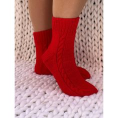 These Christmas red socks are so comfortable you'll want to wear them all year long. Our hand knit cozy socks provide a higher quality of craftsmanship, which means you can enjoy them year round, year after year.  Never again will you leave the comfort of your warm bed to be awoken by an ice cold floor beneath your feet.    These cable knit socks are stylish and sleek.  They are knitted from chunky wool and acrylic yarn. Socks are available from size 2UK/4 US up to 13UK/15US. See the sizing char Warm Red Casual Socks, Comfortable Hand Knitted Winter Socks, Casual Knitted Socks For Gifts, Comfortable Warm Red Socks, Cozy Red Socks For Winter, Cozy Red Winter Socks, Knitted Socks For Winter Gifts, Hand Knitted Socks For Winter Gift, Red Socks For Winter Gifts