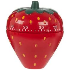 a red strawberry shaped thermometer with yellow dots