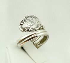 "Real vintage collectable sterling silver spoon ring with hand engraved \"B\" initial. Adjustable size. Marked \"Bridal Vail Sterling\". A great addition to your personal jewelry collection. FREE SHIPPING!! Details: Sterling Silver: (shown in picture) Ring Size: 5 3/4 (adjustable) Total Weight: 9.1 grams FREE domestic shipping by USPS Priority Mail delivery confirmation and includes insurance. If the item is to be shipped internationally Etsy will calculate postage. Please notify us at purchase Vintage Sterling Silver Engraved Stamped Ring, Vintage Sterling Silver Engraved Ring With Stamped Details, Vintage Engraved Silver Ring, Vintage Engraved Sterling Silver Ring In Antique Silver, Antique Sterling Silver Ring With Engraving Option, Vintage Engraved Ring For Collectible, Vintage Personalized Engraved Ring For Collectors, Antique Silver Engraved Stamped Ring In Sterling Silver, Vintage Engraved Sterling Silver Signet Ring