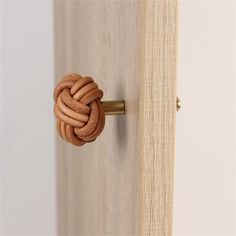 a door handle with a knot on it