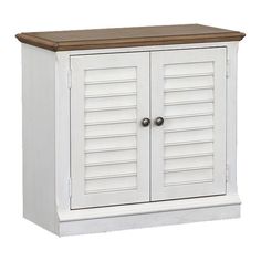 a white wooden cabinet with shutters on the doors and wood top, against a white background