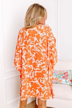 - This effortlessly chic piece embodies the essence of summer! - Unlined semi-sheer material with an orange hued floral print - A v-cut neckline - Draped half batwing sleeves - An oversized silhouette that ends in a ruffled hemline Measurements XS : Bust 56", Hip 54", Length 34", Sleeve Length 13", Waist 54". S : Bust 58", Hip 56", Length 35", Sleeve Length 13", Waist 56". M : Bust 60", Hip 58", Length 36", Sleeve Length 13", Waist 58". L : Bust 62", Hip 60", Length 36", Sleeve Length 13.5", Wai Spring Vacation Coral Dresses, Spring Coral Vacation Dresses, Coral Spring Vacation Dresses, Coral Dresses For Spring Vacation, Coral Summer Beach Dress, Spring Orange Printed Dresses, Coral Beach Dress For Summer, Orange Printed Spring Dress, Orange Beachwear Dresses For Brunch