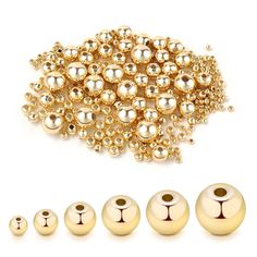 gold bead caps and beads for jewelry making, including one with an animal face on it