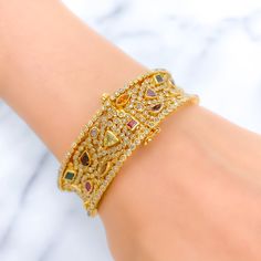 PRODUCT DETAILS Gold Purity(karat): 22k Item Weight(grams): 46.7 Item Finish: Yellow Gold Stone: Polki Diamond Diamond Weight(carats): 10.55ct Accented Stone: Tourmaline Stone Weight: 6.44ct Bangle Size: 2.4 Bangle Opening: 2.25" Openable: Yes, Hinge w/ Screw Gold Diamond Multi-stone Bracelets, Gold Diamond Bracelets With Multi-stones, Luxury 22k Gold Hand Set Bangle, Gold Bangle With Gemstone Accents, Luxury Gold Multi-stone Cuff Bracelet, Luxury Gold Cuff Bracelet With Multi-stones, Elegant Gold Bangle With Multi-stone Details, Elegant Gold Bangle With Multi-stone, Yellow Gold Multi-stone Bangle For Wedding