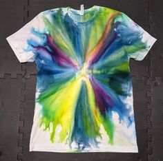 a t - shirt with colorful paint splattered on it