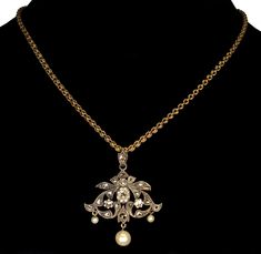 "This pendant is a great example of end of 19th century trend in jewelry. Elaborate design of the pendant incorporates total of 21 rose cut diamonds. The largest diamond, approx 5 mm across, set in crimped bezel mount in the center. The rose cut diamonds radiate a soft glitter under candle light of the ballrooms. Typically for the time the back of the pendant is gold and the front is sterling for better color fit to the diamonds especially with natural silver patina. The pendant would not be com Vintage Gold Necklace With Single Cut Diamonds, Victorian Diamond Pendant Necklace, Antique Necklace With Diamond Accents, Antique Necklaces With Diamond Accents, Diamond Necklace With Brooch For Wedding, Wedding Diamond Necklace With Brooch, Victorian Rose Cut Diamond Pendant Jewelry, Antique Single Cut Diamond Necklaces For Weddings, Antique Single Cut Diamond Wedding Necklaces