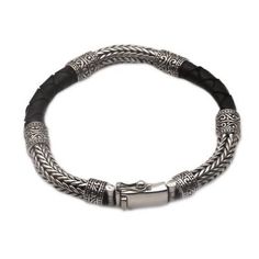 Men's Sterling Silver and Leather Bracelet in Black - Royal Weave in Black | NOVICA Modern Black Leather Bracelet With Sterling Silver, Modern Black Leather Bracelet, Elegant Black Leather Bracelet In Sterling Silver, Elegant Black Leather Bracelet With Sterling Silver, Modern Adjustable Black Sterling Silver Bracelet, Classic Black Bracelet With Silver Chain, Silver Leather Bracelet For Formal Occasions, Classic Black Bracelets With Silver Chain, Black Leather Bracelets With Sterling Silver Clasp