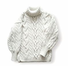 a white sweater with cable knits on the shoulders and collar, in front of a white background