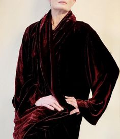 This dramatic vintage evening coat and dress is made of thick, luxurious silk velvet in a deep, rich burgundy. The open front coat sweeps down to the floor, and features a wide shawl-collar and bell sleeves. The sleeveless dress with scoop neck, has a slightly a-line shape, and is finished with mother-of-pearl side buttons. Vintage, ca. 1990s 100% silk Made in U.S.A  Machine washable Tagged size Large Measurements (taken flat) Dress: Bust pit to pit: 20in./50.8cm. Waist: 20.5in./52.07cm. Hip: 23.5in./59.69cm. Length: 51in./129.54cm. Coat: Pit to pit: 24in./60.96cm. Length: 56in./142.24cm. Citron Santa Monica is an exclusive women's boutique, specializing in unique apparel, made of embossed silk, velvet, and satin. Fabrics are transformed into stunning wearable works of art using artisan te Elegant Velvet Outerwear For Costume, Elegant Formal Robe For Fall, Fitted Formal Robe For Fall, Elegant Shawl Collar Robe For Fall, Vintage Velvet, Silk Velvet, Shawl Collar, Vintage Silk, Ladies Boutique