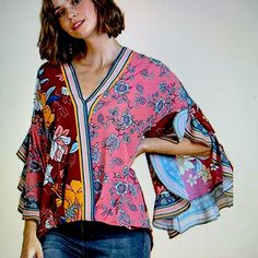 Polyester, Umgee, Bell Sleeve, Cross Front, Snap Closure, Hand Wash Only, V Neckline. Only On Poshmark Chic Multicolor Patchwork Blouse, Red Patchwork Blouse For Spring, Pink V-neck Patchwork Top, Pink V-neck Blouse With Vibrant Print, Spring V-neck Patchwork Blouse, Pink Tops With Vibrant Print For Brunch, Vibrant Print Multicolor Blouse For Brunch, Vibrant Print Pink Top For Brunch, Pink Vibrant Print Top For Brunch