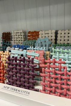 several different colored chairs are stacked on top of each other