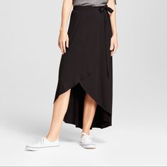 An Ultra-Soft Material Lends Just The Right Amount Of Comfort To This Simple Midi Skirt, And The Wrap Silhouette Flows Beautifully With Every Step You Take While Offering A Flattering Look You'll Love. Easily Dressing Up Or Down To Suit Any Occasion, You Can Wear The Skirt With A Tucked-In T-Shirt And Canvas Sneakers For A Casual Outing, And Then With A Blouse, Leather Jacket And Strappy Sandals For A Casual-Chic Date Night Look. Material: 95% Rayon And 5% Spandex Casual High Waist Black Maxi Skirt, Casual High-low Hem Bottoms For Day Out, Casual High-low Hem Skirt For Day Out, Casual Black Wrap Skirt For Summer, Casual Black Bottoms With High-low Hem, Casual Solid Color Flowy Wrap Skirt, Black High Waist Wrap Skirt For Summer, Summer High Waist Black Wrap Skirt, High Waist Black Wrap Skirt For Summer