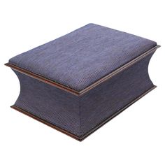 a blue and brown box sitting on top of a white surface