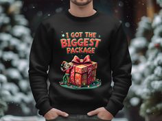 🎁 I Got the Biggest Package - Unwrap the Fun This Holiday Season! 🎁   Add some humor to your holiday wardrobe with our "I Got the Biggest Package" shirt! This cheeky and playful design is perfect for spreading laughs at Christmas parties, family gatherings, or any festive occasion. Whether you're gifting it to a friend or showing it off yourself, this shirt is sure to be a hit!   Crafted with the help of AI, this design brings a unique twist to your holiday outfits. Available in a unisex fit, Christmas Crew Neck Shirt Gift, Christmas Gift Crew Neck Shirt, Funny Christmas Sweater, Christmas Sweater Funny, Funny Holiday Shirts, Xmas Tees, Funny Christmas Sweaters, Christmas Tops, Holiday Shirt