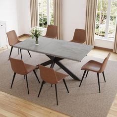 a dining room table with six chairs and a potted plant in the center on top