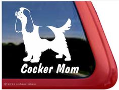 a cocker dog sticker on the side of a car