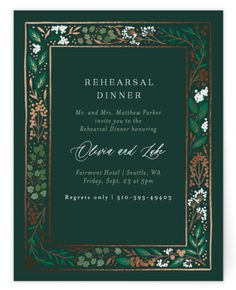 a green and gold wedding dinner card with an ornate frame in the center, surrounded by white flowers