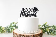 a white cake with black lettering on top