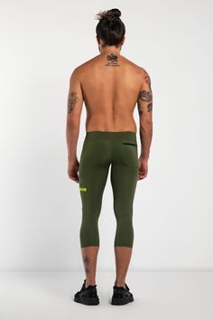 Sustainability Meets Performance. The Performance PRO “Eco Range” uses recycled plastic bottles, fishing nets and ring pulls to create a high compression technical fabric that’s super tough and better for the planet. See them in action here. Description: Green Khaki Men's ¾ Leggings With Two Pockets Recycled Polyester / Spandex Thigh phone pocket + zipper hip pocket Squat tested with zero transparency Moisture wicking with 4-way stretch Flatlock seams to reduce chafe Invisible soft-grips to prev Compression Bottoms With Side Pockets For Outdoor, Compression Bottoms With Side Pockets For Outdoor Activities, Green Compression Bottoms For Outdoor Activities, Compression Tights With Side Pockets, Functional Compression Bottoms With Hip Pockets, Stretch Running Bottoms With Hip Pockets, Technical Stretch Bottoms With Pockets, Functional Green Leggings With Pockets, Stretch Activewear With Hip Pockets For Outdoor